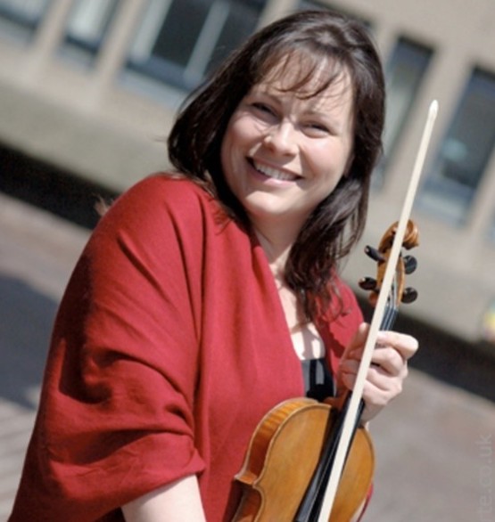 Photograph of Nicole Wilson holding a violin